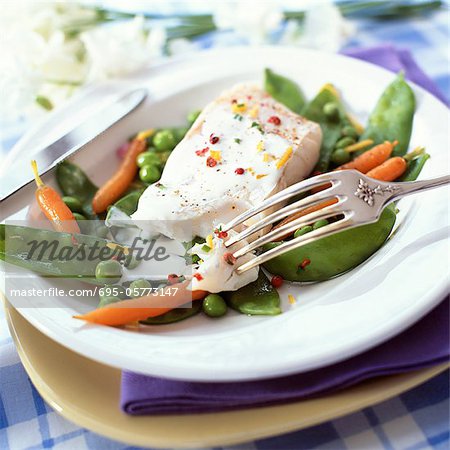Bowl of fish and spring vegetables, close-up