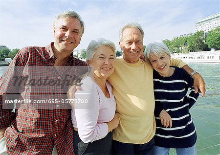 France, Paris, mature men and women standing in front of the River Seine