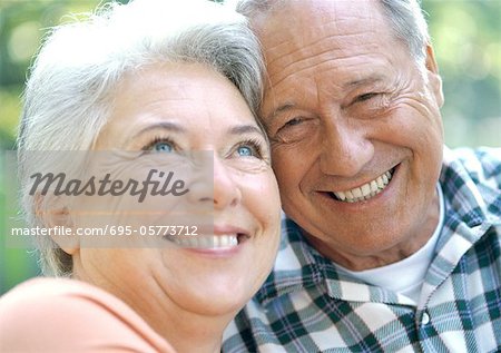 Mature man and woman smiling, close-up,  portrait