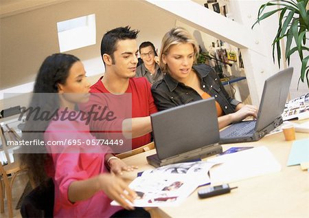 People working with laptops in office, close-up