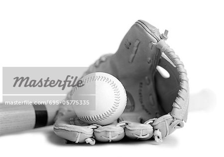 Baseball glove, ball and bat, close-up, b&w.