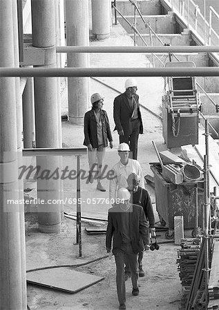 Five people in construction site, elevated view, b&w