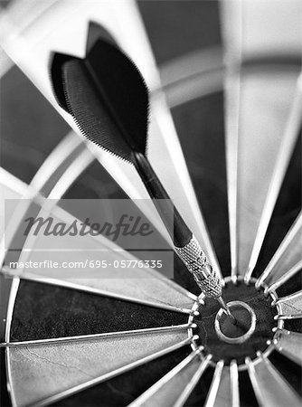 Dart in center of dartboard, close-up