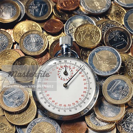 Stop watch and assorted euro coins Stop watch and assorted euro coins