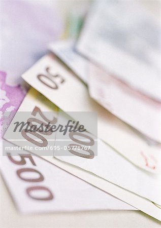 Mixed denomination euro bills, offset, close-up