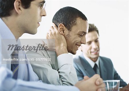 Businessmen sitting together in meeting