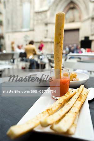 Breadstick dipped in sauce