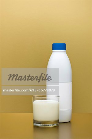 Glass and bottle of milk