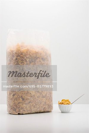 Food concept, cereal bag with small bowl of cereal