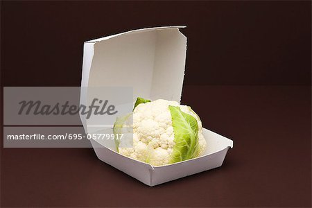 Food concept, fresh cauliflower inside fast food container