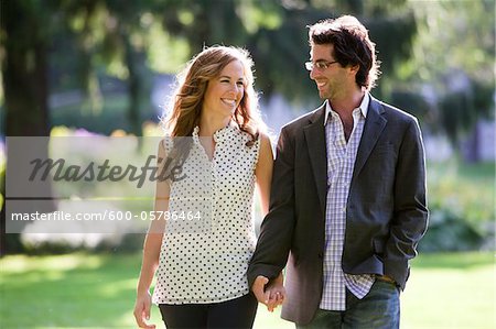 Young Couple Walking through Park