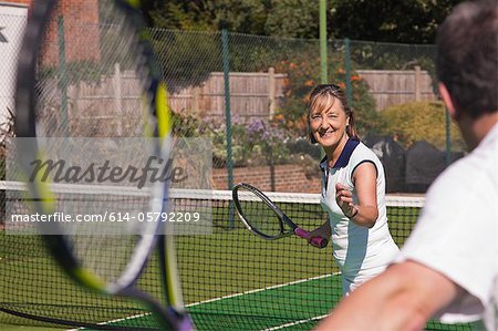 Senior couple playing tennis