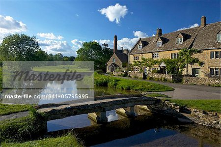 River Eye flowing through the pretty village of Lower Slaughter, the Cotswolds, Gloucestershire, England, United Kingdom, Europe