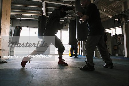 Trainer and Boxer Practicing