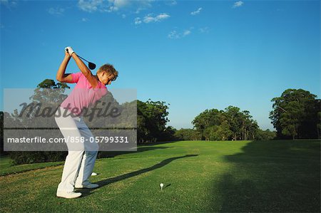Golfer Preparing for Tee Shot Golfer Preparing for Tee Shot