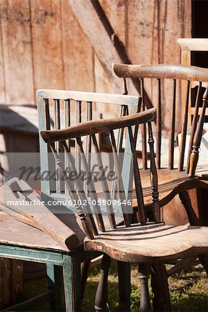 Old wooden chairs on outdoor auction