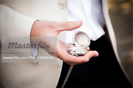 Groom Holding Pocket Watch