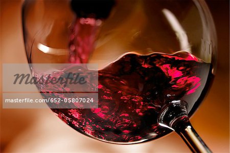 Pouring a glass of red wine Pouring a glass of red wine