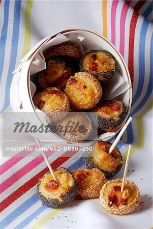 Small bacon and cheese flaky rolls with sesame and poppyseeds Small bacon and cheese flaky rolls with sesame and poppyseeds