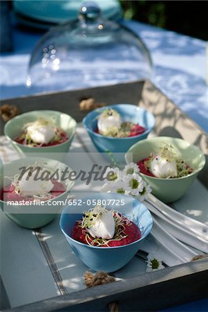 Bowls of beetroot mousse,fresh goat's cheese quenelle and alfafa