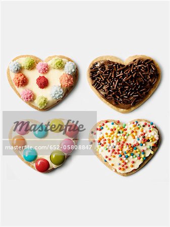 Four heart-shaped decorated cookies