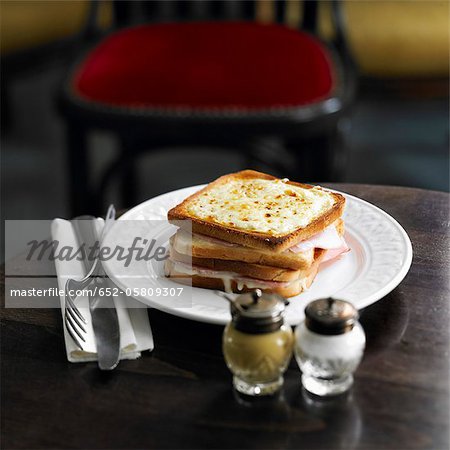 Ham and cheese  toasted sandwich topped with grilled cheese