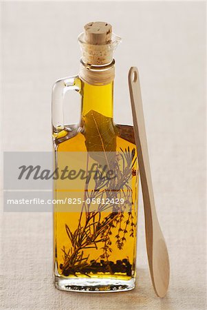 Bottle of olive oil flavoured with herbs