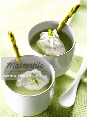 Cream of green asparagus soup with whipped chervil cream