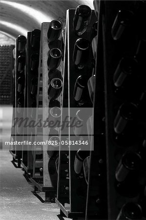 Racks of wine bottles in a cellar