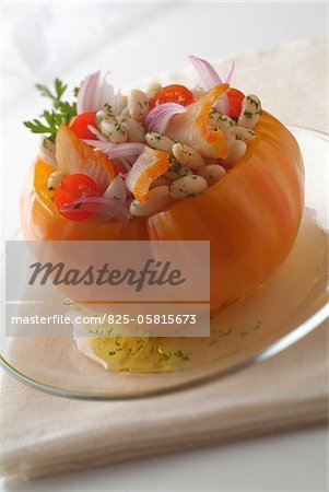 Yellow tomato stuffed with haddock and haricot beans