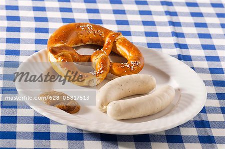 Plate with Weisswurst and pretzel