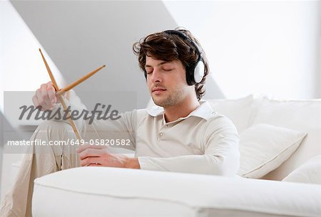 Man playing with drumsticks