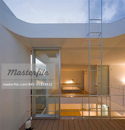 House in Hatsukaichi, Private House, View of the bedroom on the 2nd floor from the roof terrace. Architects: Toru Murakami Architect and Associates