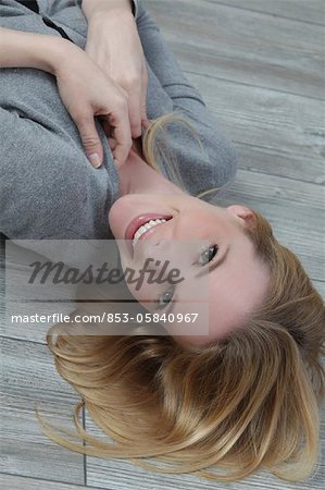 Young blond woman smiling at camera