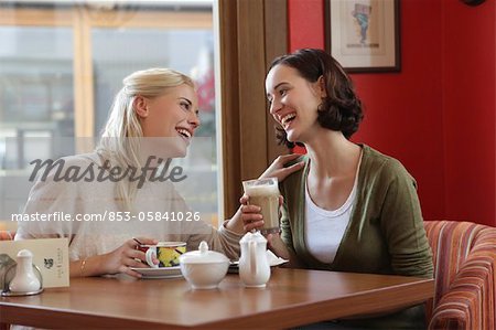 Two girl friends at cafe