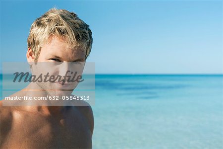 Young man on beach, portrait