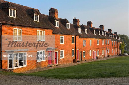 Summer morning sunshine glows on the terraced cottages at Bucklers Hard, Hampshire, England, United Kingdom, Europe