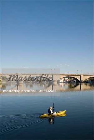 Early morning kayaker and London Bridge, Havasu City, Arizona, United States of America, North America