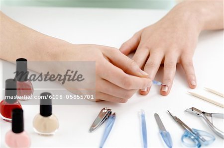 Woman manicure, with different accessories, close up (studio)