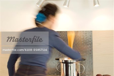 Woman cooking pasta