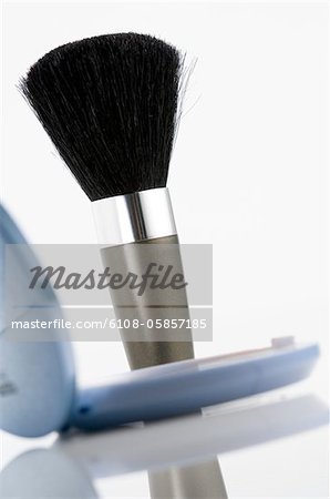 Eye-shadow box and make-up brush, close-up