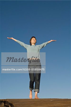 Young woman on a pontoon, outdoors