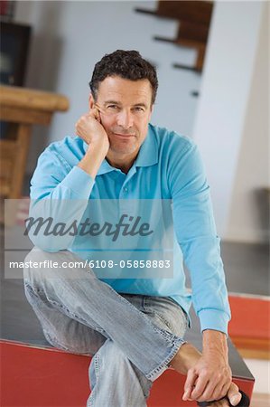Man sitting, indoors
