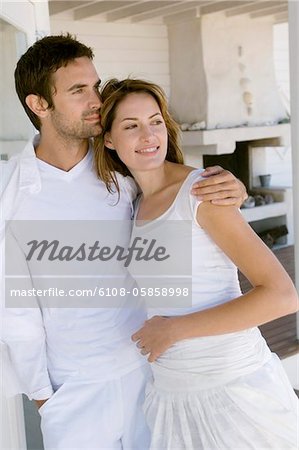 Couple embracing on wooden terrace