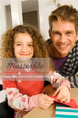 Portrait of a girl smiling with her father