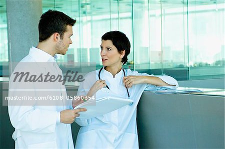 Two doctors discussing a medical record