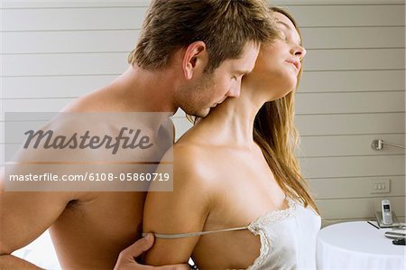 Mid adult man and a young woman romancing