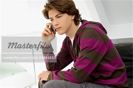 Close-up of a teenage boy talking on a mobile phone