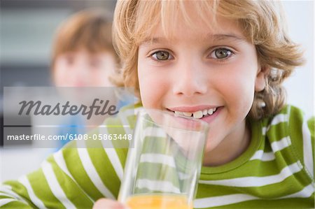 Boy drinking a glass of juice