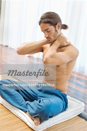 Man massaging his neck